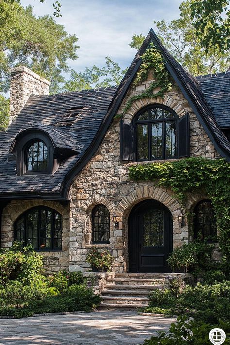 Rustic stone cottage with arched windows. Enter a world where whimsical charm meets shadowy intrigue, as this article unveils the enchantingly moody essence of dark cottagecore houses. Charming Brick House, Modern English Cottage Floor Plans, Single Story Tudor House Plans, Stone House Black Windows, Stone Tudor House, Vintage Exterior House, Single Person House, Small Home Exterior Ideas, Black And Brick House Exterior