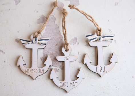 "Cutest little anchor ornament for your coastal Christmas tree!! This adorable anchor ornament is 3.75\" x 2.5\" and laser cut and engraved from birch wood.   Jute rope is added for hanging. Choose either to have the year engraved on the ornament or the ribbon shown. This anchor ornament comes in a distressed white and the town name or last name is laser engraved. Add your town or name to the ornament." Diy Anchor, Hope Sign, Nautical Ornaments, Small Anchor, Coastal Ornament, Coastal Christmas Tree, Town Names, Staff Appreciation, Coastal Christmas