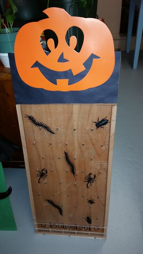 Halloween Plinko Halloween Plinko Board, Halloween Plinko Board Diy, Halloween Ball Toss Game, Cardboard Plinko Game, Halloween Bean Bag Toss Diy, Diy Drinko Plinko Game, Plinko Game, Fall Festival Games, Festival Games