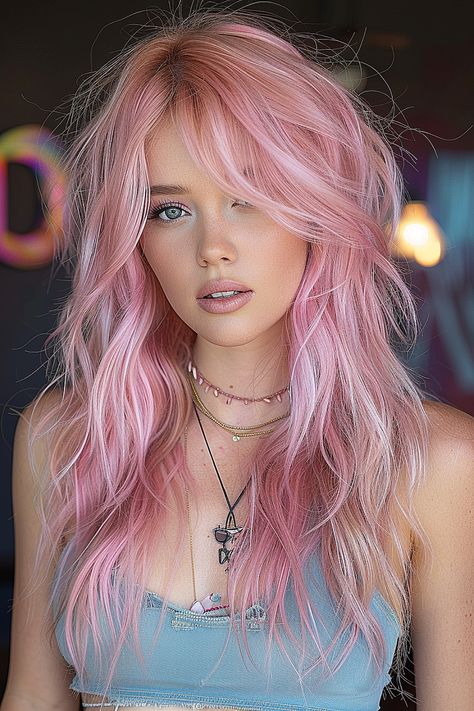 A woman with a pastel pink long shag haircut featuring airy, feather-light layers. Pink Shag Hair, Pink Layered Hair, Faux Mullet, Blonde Hair With Pink Tips, Long Choppy Haircuts, Golden Ombre, Hair 2025, Long Shag Hairstyles, Long Pink Hair