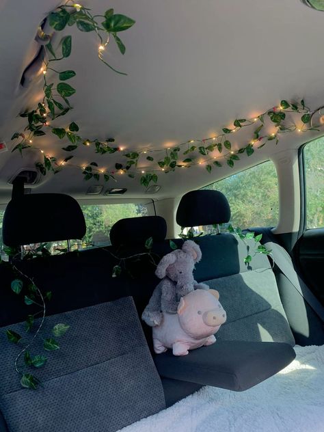 my car + vines = home 💚 -  #Car #home #Vines Car Roof Decorations Interior, Dream Car Interior Aesthetic, Stuffed Animals In Car, Car Decor Theme, Cute Car Sun Shade, Nature Themed Car Interior, Car Seat Decor, Tapestry In Car Roof, Inside Truck Aesthetic