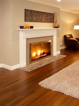 Walnut floor with great contrast of whites & tans for the rug, fireplace tiles, wall... Living Room Colour Schemes, Cherry Wood Floors, Living Room Wood Floor, Brown Floors, Room Color Schemes, Bamboo Flooring, Flooring Ideas, Floor Colors, Interior Floor