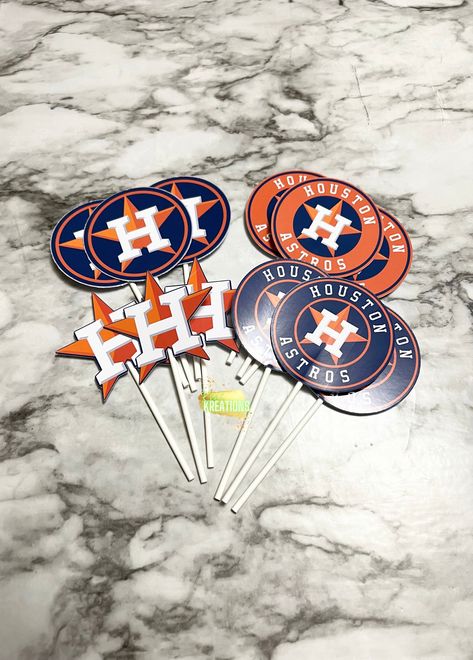 "1 dozen Houston Astros themed cupcake toppers. Each dozen comes with 4 different Houston Astro designs, 3 of each. The cut outs measures are 2.5\" in height and width and are on a 4 inch lollipop stick. Please see my shop announcement on the homepage to see when I am booked out for orders. NOTE: All copyrights and trademarks of the character images used belong to their respective owners and are not being sold. This listing is for my time and effort used to create and personalize the designs." Astros Christmas Tree, Astros Party, Lollipop Sticks, Black Christmas Trees, Christmas Tree Topper, Themed Cupcakes, Superbowl Party, Tree Topper, Juventus Logo