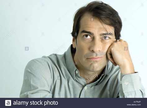 Man leaning head on hand, looking up, portrait Stock Photo Lean On Hand Pose, Leaning Face On Hand Pose, Man Resting Head On Hand, Leaning Head On Hand Pose, Head Leaning On Hand Reference, Head Leaning On Hand, Head On Hand Pose, Head Resting On Hand Pose Reference, Hand Resting On Face