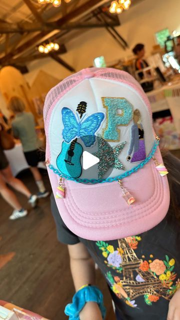 Mica May on Instagram: "Trucker Hat Bar!? 💖💯⚡️✌️😍 We are all over this trend. When we do a pop up (and WOW does @shopminimarkets know how to partay!) we want to bring something fresh and interesting each time, so you get to a see a little sampling of what we do in the studio. From a succulent bar to marble ornaments, this year we wanted something super on trend for summer. 👏 This trucker hat bar with alllllllll the patches and hat chains + charms was a FAV activation so far…and pretty sure we need to add this to our party line up. Yes? ✌️ Thx to everyone who came out to support us in the rain today, y’all are the best!!  #shopsmallbusiness #austindiystudio #truckerhats #truckerhatbar #diytruckerhat" Hat Patch Bar, Trucker Hat Bar Pop Up Shop, Trucker Hat Party Ideas, Trucker Hat Chains Diy, Hat Decorating Party, Iron On Trucker Hat Diy, Trucker Hat Chain Diy, Diy Hat Bar Party, Trucker Hat Party