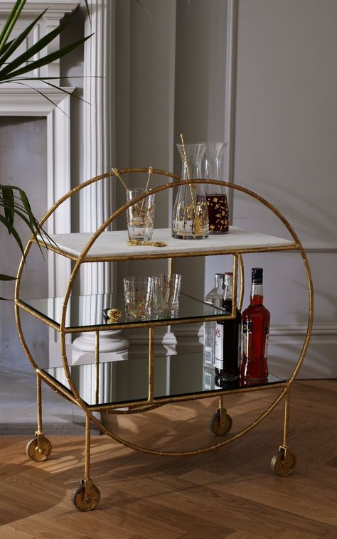 Oliver Bonas' gilt and marble Luxe Round Bamboo Trolley (£395) Bar Deco, Bandeja Bar, Gold Bar Cart, Bar In Casa, Bar Cart Styling, Drinks Trolley, Bar Cart Decor, Living Room Cabinets, Contemporary House Design