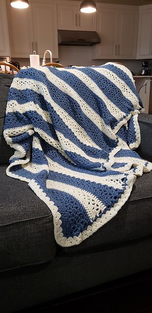 About 60" x 72", perfect size for covering up on the couch. Made with Wintuk yarn in colonial blue and white; 100% acrylic for machine washing and drying on delicate. #crocheted #throws #afghans Blue And White Blanket, White And Blue Crochet, Blue And White Crochet Blanket, Light Blue Blanket, Blue Crochet Blanket, Double Knitting Patterns, Throw Blanket Pattern, Crochet Throw Blanket, Willow Pattern