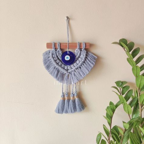 Evil eye cute macrame wall hanging ♥️ For the love of pastels. A cute decor for your foyer, office space, entrance, door, wall pillars etc. #macrame #macrameindia #evileye #turkish #evileyedecor #evileyecharm #macramelovers #decor #doorway #walldecor #interior #desidecor #art #positivevibes #homeinterior #nazar Foyer Office, Cute Macrame, Greek Eye, Cute Decor, Entrance Door, Macrame Art, Evil Eye Charm, Door Wall, Car Charms