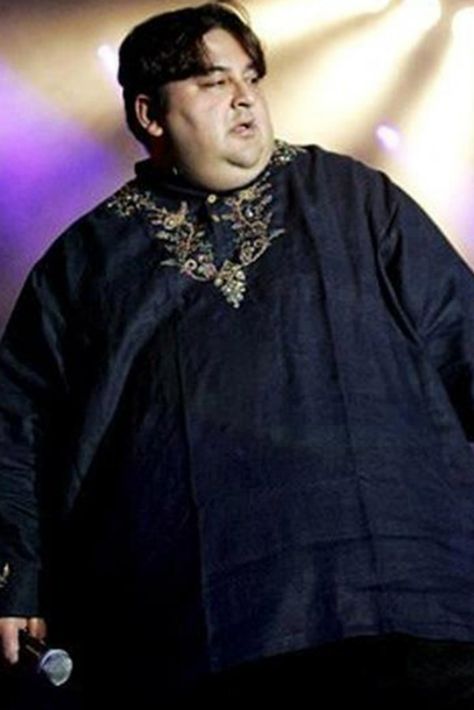 We grew up with Singer Adnan Sami crooning his way into our hearts with songs like Kabhi To Nazar Milao, Tu Sirf Mera Mehboob, and Tera Chehra. Blessed with a powerfully soulful voice, Sami easily stood out from the rest.  Another factor that stood out about him was that he weighed a hefty 230 kgs at that time. But gone are his obese days, now the singer is nearly unidentifiable thanks to an unbelievably incredible weight loss journey.  © TwitterPre 2007, Adnan Sami we Adnan Sami, Celebrity Workout, Bollywood Actors, Transformation Body, The Secret, The Voice, The Incredibles, Songs