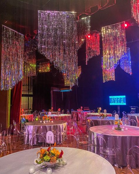 1980s Prom Decorations, Drag Show Decorations, 2023 Backdrop Trends, Prom Wedding Theme, Neon Light Centerpieces, Disco Ceiling Decor, Disco Theme Gala, Fringe Ceiling Decor, Disco Centerpieces