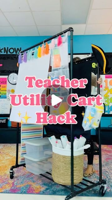 Samantha | Elementary Teacher on Instagram: "⬇️ Teacher Utility Cart Details ⬇️

I love a great hack! This is a clothing rack from Amazon. You can click the link in my profile for ALL the links you need to do this yourself! 

I used clear hanging shoe storage to stash supplies like markers and sticky notes. I cut it to fit the spaces I needed. 

I used a combo of shower curtain rings and binder rings to hang the anchor chart and pocket charts. The plastic bins and basket work great for extra storage below! And cute rainbow tassels to dress it up 😍 

Have any questions, drop them in the comments! Or if you want the link to this project, let me know and I’ll send it your way 🫶🏼

Blog Post -> http://www.teachingwithsamanthasnow.com/httpswwwinstagramcommrshenryinfirst/classroom-inspiration- Teacher Space Organization, Anchor Chart Storage, Classroom Table Organization, Pocket Chart Stand, Teacher Cart, Hanging Shoe Storage, Pocket Charts, Classroom Charts, Classroom Anchor Charts