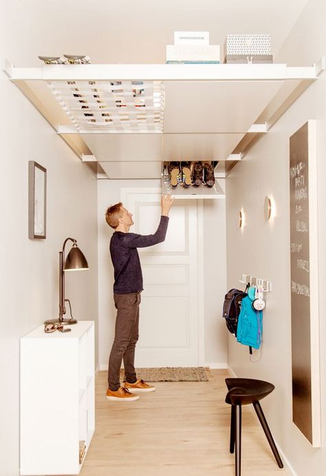 15 Storage Ideas for Small Spaces - RTF | Rethinking The Future Overhead Storage Bedroom, Overhead Storage Ideas, Storage Ideas For Small Bedrooms, Peg Board Walls, Ceiling Storage Rack, Overhead Storage Rack, Ideas For Small Bedrooms, Wall Storage Cabinets, Storage Ideas For Small Spaces