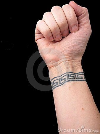 Fist With Wrist Tattoo in Greek Key Pattern over Black Background by Rebekah  Burgess, via Dreamstime Greek Pattern Tattoo, Wrist Band Tattoo, Best 3d Tattoos, Meaningful Wrist Tattoos, Key Tattoo, Free Tattoo Designs, Cool Wrist Tattoos, Wrist Tattoos For Guys, Greek Key Pattern