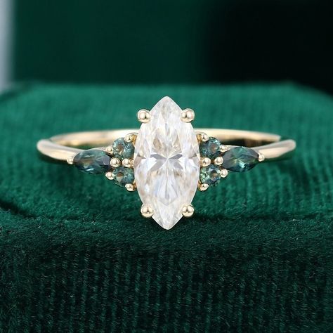 Pear Engagement Ring With Emerald, Green Sapphire Engagement Ring Marquise, Simple Engagement Rings Marquise, Marquise Engagement Ring With Sapphires, Colored Marquise Engagement Ring, Marque Cut Engagement Ring, Green Sapphire Marquise Ring, Marquise Vintage Ring, Marquise Engagement Ring Sapphire