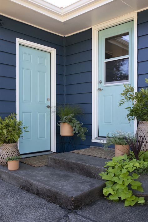 Step outside to even more color! On the back side of the house, doors to the garage and kitchen are painted Outer Space | 0686. This soft shade of blue creates a calming and tranquil effect that sets the tone for a relaxing backyard experience. Mid Century Southwest, Aqua Front Doors, Teal Front Doors, Teal Door, Turquoise Front Door, Relaxing Backyard, Door Colors, Front Door Colors, Day Spa