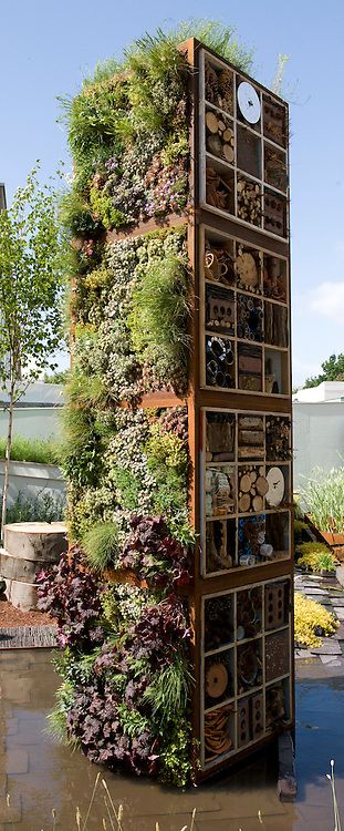 Tower containing living wall and bug boxes or insect hotels. “Future Nature” Garden, by Ark Design Management Ltd, RHS Chelsea Flower Show 2009. Bug Hotel Wall, Insect Hotel Ideas, Bugs Hotel, Insects Hotel, Garden For Bees, Bees Garden, Bee Hotels, Bug Garden, Bug Box