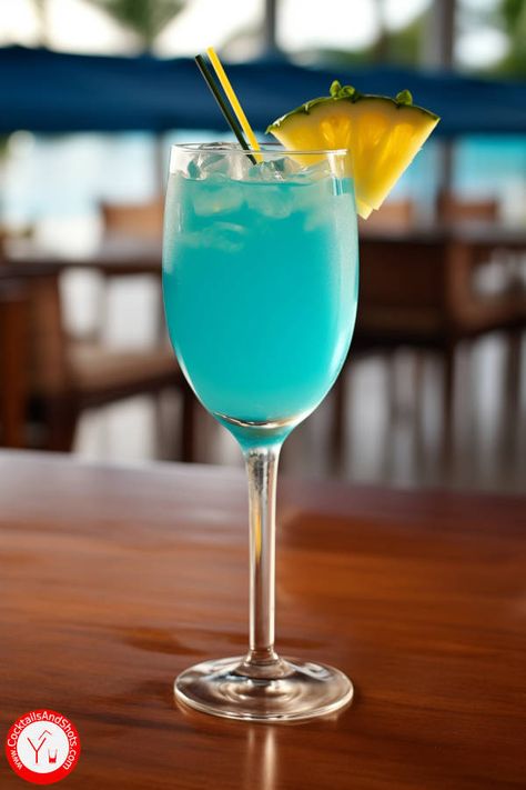 How to make the Holy Water cocktail recipe made with vodka, rum, Blue Curaçao, Peach Schnapps, Coconut Cream, Pineapple Juice and... Vodka And Pineapple Juice, Peach Schnapps, Blue Curacao, Coconut Rum, Water Recipes, Holy Water, Cocktail Glass, Cocktail Recipe, Pineapple Juice