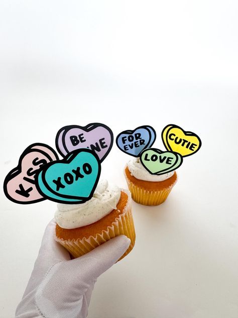 Oh hello there! No one likes a boring party, that's why we are here to help! Handmade in Colorado, our adorable sweetheart candy heart cupcake toppers complement party themes ranging from Valentines Day parties to adorable bridal showers and every event in between.  Each topper is 2x2 inches on a wooden toothpick base.  Available in sets of 1 topper, 6 toppers, 12 toppers, or 24 toppers. You can order additional packs if more toppers are needed.  If ordering less than 6, please leave a note of which phrase you would like.  choose from: Kiss Forever Cutie Love Be Mine xoxo Please reach out if you would like custom phrases.  We're just a message away if you have any questions. Thanks for Shopping!  xoxo ✨Just One Moon✨