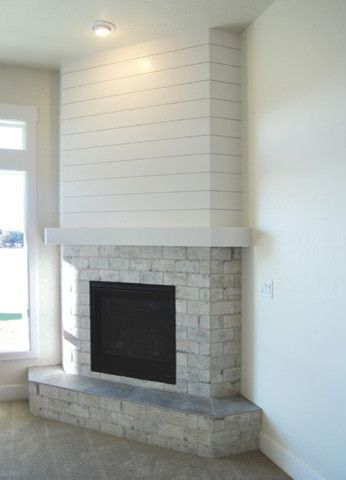 San Savino - Family Room with Corner Fireplace - Transitional - Family Room - Boise - by Gallery Homes by Varriale | Houzz Family Room With Corner Fireplace, Corner Brick Fireplaces, Room With Corner Fireplace, Corner Fireplace Living Room, Corner Fireplace Ideas, Craftsman Dining Room, Corner Electric Fireplace, Transitional Family Room, Farmhouse Fireplace Decor