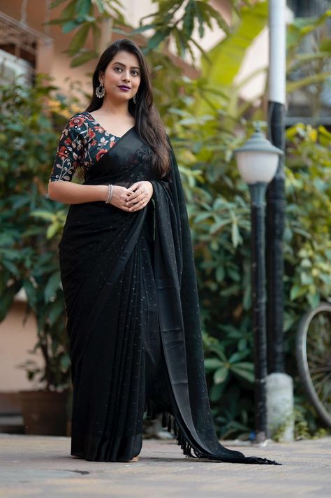 *best seller * New single color edition launch This saree is designed for those who love black. Paired both contracted and tone to tone blouse from which Customers can choose their perfect black saree look. *Rf- BLACK BUTTI.* *Quality*- soft georgette saree with shining woven butti allover and satin pattu border. Zalar threading on pallu. *Blouse*- jute silk printed blouse with aari mirror work. *Length-* Saree- 5.5 meters. Blouse- 1 meter. *Rate- 1145/- Black Blouse Designs, Mirror Work Blouse, Pattu Saree Blouse Designs, Black Attire, Plain Saree, Half Saree Designs, Trendy Dress Outfits, Black Saree, Elegant Saree