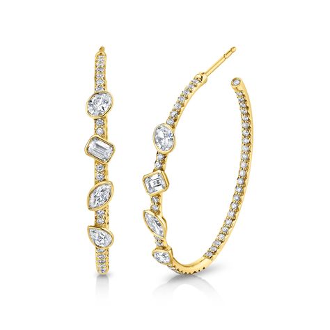 Introducing our stunning Hoop Earrings with Fancy Shape Diamonds, meticulously crafted for the perfect blend of elegance and style. Each earring features a collection of fancy-shaped diamonds, showcasing their unique beauty. Set in a secure and modern bezel setting, these earrings offer a contemporary twist on a classic design. Fancy Hoop Earrings, Fancy Shape Diamond Jewellery, Diamond Drop Earrings Simple, Jewellery Advertising, Rings Opal, Diamond Earrings Design, Diamond Choker Necklace, Diamond Huggies, School Jewelry