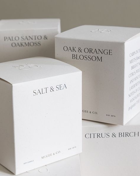 Hand-poured and labeled by artisans in small batches, the Salt & Sea Candle was thoughtfully created to bring the refreshing coastal air into your home. Curated and developed by us, its aroma has top notes of lemon and bergamot, blending floral notes with undertones of sea salt, driftwood, and musk. Its hand-blown glass jar has a stunning aesthetic, and can easily be recycled as a vase or organizational piece after its use. Slow-burning soy wax, cotton wicks, and therapeutic essential oils give Eco Friendly Candle Packaging, Jar Candles Ideas, Luxury Candles Labels, Candle Labels Ideas, Candle Booth Display, Candle Box Design, Sea Salt Candle, Sea Candles, Mood Candles