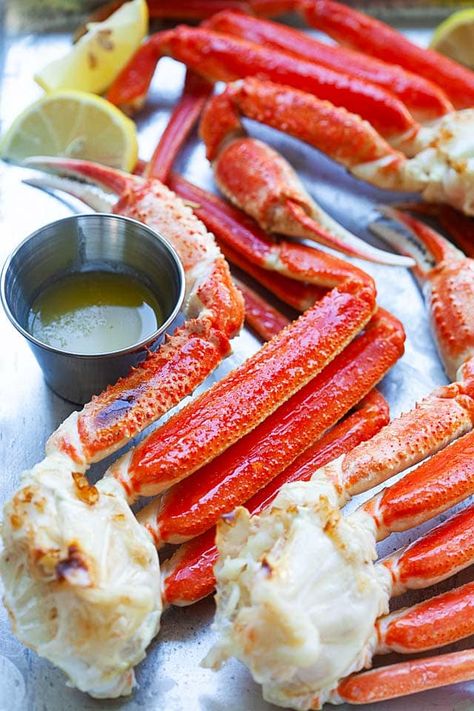 Snow crab legs served with melted butter and lemon wedges. Crab Leg Recipes Boiled, Crab Broil, Legs At Home, Crab Legs Recipe, Wooden Skillet, Snow Recipe, Snow Crab Legs, Snow Crab, Lobster Dishes