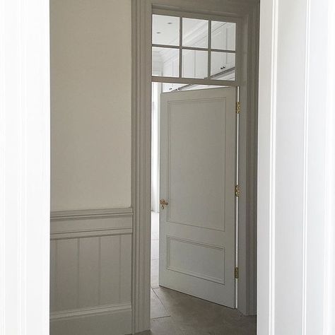 Bespoke door and panelled walls with glass panel above door to let light and shadows into hallway.....#interior #interiordesign #minniepetersblog #minniepetersinteriordesign #decor Interior Door With Window, Apartment Entrance Ideas, Window Above Door, Interior Doors With Glass Panels, Panel Doors Interior, Panelled Walls, Hallway Interior, Apartment Entrance, Internal Glass Doors