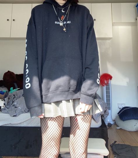 a female model wears an oversized black hoodie with the text “unus annus” written on it, with the number 00:00:00 on one arm and 365:00:00 on the other arm. she wears a white and brown plaid skirt with pleats, with black fishnet tights underneath. she wears several chunky chain necklaces over the hoodie, as well as a black diamanté studded choker Edgy Hoodie Outfit, Oversized Hoodie Outfit Grunge, Hoodie Outfit Skirt, Oversized Hoodie Outfit Summer, Skirts With Baggy Shirts, Hoodie Outfit Grunge, Big Hoodie And Skirt Outfit, Oversized Hoodie Skirt Outfits, Oversized Hoodie With Skirt