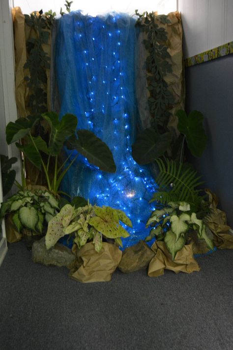 Waterfall at end of hallway. Hallway decorated as a rainforest. Fake Waterfall, End Of Hallway, Waterfall Decoration, Jungle Decorations, Vbs Themes, Deco Nature, Jungle Party, Forest Theme, Vacation Bible School