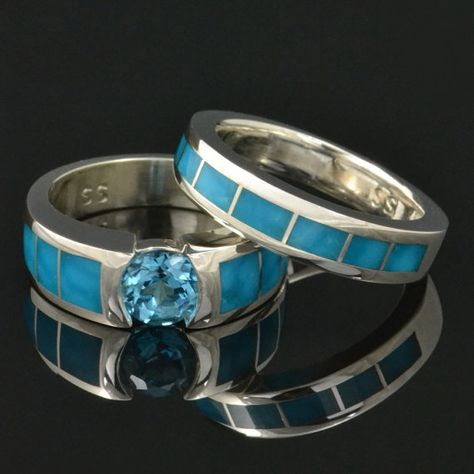 Beautiful turquoise wedding band and engagement ring in sterling silver. Both the engagement ring and the wedding band are inlaid with blue Kingman turquoise with a birds eye pattern. The engagement ring has 3 pieces of turquoise inlaid on each side of a center set blue topaz. The 1 ct. topaz is set almost flush with the silver and the color looks great with the turquoise. The matching wedding ring is inlaid with 7 pieces of turquoise that perfectly match the turquoise in the engagement ring. Turquoise Wedding Ring Set, Turquoise Wedding Ring, Turquoise Jewelry Rings, Turquoise Wedding Rings, Turquoise Wedding Band, Gold Stacking Rings Wedding, Turquoise Ring Engagement, Couple Wedding Rings, Turquoise Wedding