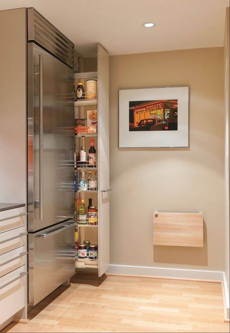 Drawers and pullout pantries, like the one at right, make the most of awkward spaces. They allow easy access to the back of the storage area. Modern Kitchen Pantry, Professional Kitchen Design, Model Dapur, Hidden Pantry, Space Saving Kitchen, Interior Remodel, Yellow Bathrooms, Pantry Design, Remodel Bedroom