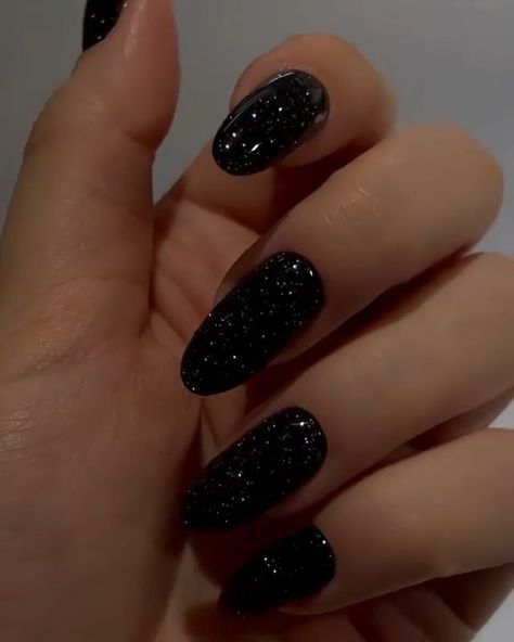 Glitter Black Almond Nails, Black Shimmer Nails Acrylic, Almond Nails For Black Dress, Prom Nails Black Sparkle, Prom Nails Acrylic Black Dress, Black Sparkle Almond Nails, Nails To Go With Black Dress Prom, Shimmer Black Nails, Black Sparkly Prom Nails