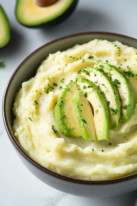 Indulge in a creamy and nutritious twist to classic mashed potatoes with avocado. Elevate your dinner table with this unique and flavorful dish that will surely impress your guests. Whether you're a fan of avocados or looking to add a healthy touch to your meal, this recipe is a must-try. Avocado adds a velvety texture and subtle earthy flavor to the mashed potatoes, making it a delicious side dish for any occasion. Healthy Mashed Potatoes, Classic Mashed Potatoes, Mashed Potato Recipes, Mashed Potato, Creamy Mashed Potatoes, Ripe Avocado, Fresh Chives, Yummy Sides, Potato Recipes