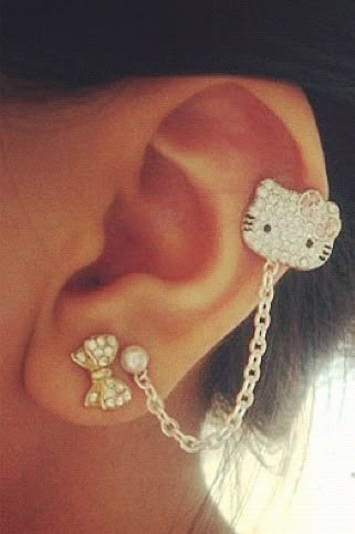 Love it!! hello kitty earing Hello Kitty Design, Hello Kitty Background, Kitty Background, Hello Kitty Things, Nostril Piercing, Diy Easter Gifts, Hello Kitty Jewelry, Hello Kitty Space, Cool Ear Piercings