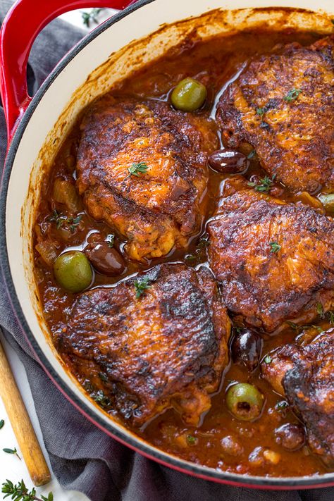 Rustic and saucy, this rich and flavorful braised chicken with tomatoes and olives, plus a tiny hint of white wine, is a simple peasant-style meal finished in the oven to juicy perfection, served with your favorite side. | thecozyapron.com #recipes #dinnerideas #chickenrecipes #braisedchicken Chicken Receipts, Coq Au Vin Recipe, Braised Chicken Thighs, French Recipes, Braised Chicken, Chicken Dinners, Individual Servings, Recipe Chicken, Kitchen Stories