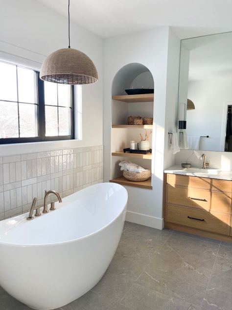 Arched wall niche with white oak shelves Arched wall niche with white oak shelves by freestanding tub #Archedwallniche #whiteoakshelves #Archedniche #freestandingtub Tile Accent Wall Behind Freestanding Bathtub, Freestanding Tub Backsplash, Free Standing Bath Tub Tile Surround, Arch In Bathroom Wall, Built In Shelves Next To Shower Stall, Niche Behind Freestanding Tub, Bathtub And Shower Design Inspiration, Bathroom Standing Tub, Bath Near Window