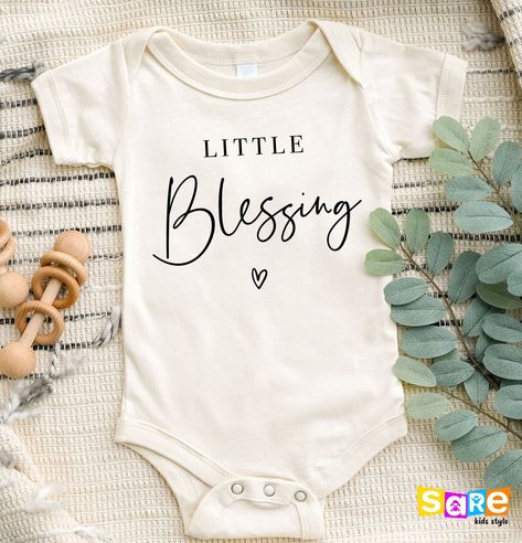 Little Blessing Shirt, Cute Little Blessing Onesie®, Christian Kids Tee, Baby Shower Gift, Baby Announcement Gift, New Mom Gift, Family Tee, Gender Reveal Gift, Funny Newborn Bodysuit, Funny Newborn, Cute Baby Clothes, Gift for Newborn, Babyshower Gift, Babyshower Shirt, Newborn Girl Gift  Welcome to SareKidsStyle! HOW TO ORDER * Please review all the information provided before placing an order. 1. Select the style and size using the drop-down menu. 2. Select color 3. [APPLICABLE ONLY ON CERTAI Christian Baby Announcement, Christian Baby Onesies, Baby Onesie Ideas, Baby Onsies Ideas, Christian Baby Shower, Baby Announcement Onesie, Baby Onsie, Gender Reveal Gifts, Newborn Bodysuit