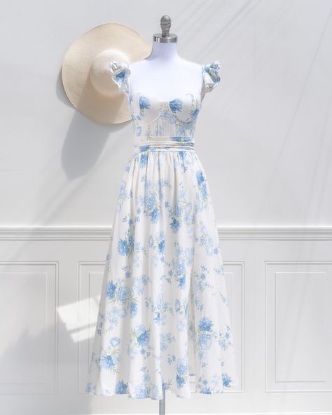 🦋 The Budding Romance Dress 🦋 Enchantingly lovely, this linen blend style might just be our favorite spring dress! Featuring a structured corset-style bodice and a beautiful blue and white floral print, this dress is sure to stun at your next event! Luxury Romantic Blue Corset Dress, Blue Floral Corset Dress, Luxury Spring Floral Print Corset Dress, Feminine Sleeveless Floral Print Corset Dress, Blue Floral Cottagecore Dress, Romance Dress, Structured Corset, Blue And White Floral, Spring Clothes