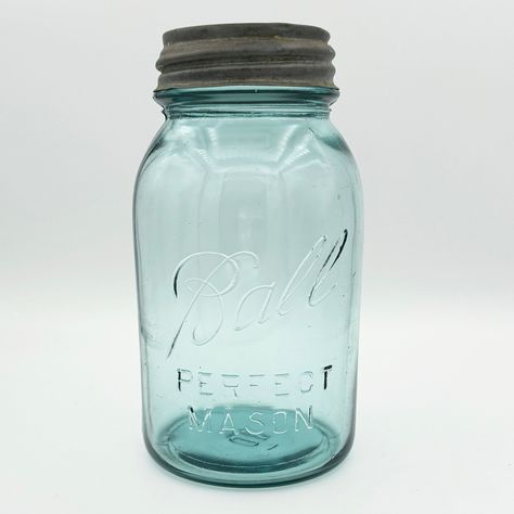 "What makes this quart-sized Ball PERFECT MASON jar rare is that it should not exist! The 'Ball Blue' PERFECT series ended in 1922, and the logo on this jar was only used from 1923 to 1933. (Notice there's no underscore.) This jar was one of the last in the PERFECT series but one of the first with the 'new' logo.  The color of this quart-sized Perfect Mason Ball jar is commonly referred to as \"Ball Blue\", a color that came from sand used to make glass taken from the Hoosier Slide sand dune on Antique Crocks Decor Ideas, Crocks Decor Ideas, Crocks Decor, Antique Dishes Collectible, Milk Glass Decor, Ball Canning Jars, Antique Crocks, Vintage Glassware Antiques, Old Glass Bottles