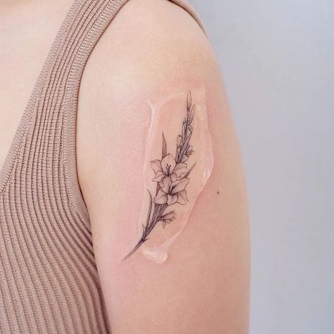 Gladiolus Rib Tattoo, Gladiolus Flower Tattoo Design, Poppy And Gladiolus Tattoo, Goat Tattoo Ideas, Tattoos Lily Of The Valley, Gladiolus Tattoo Simple, Gladiolus Tattoo Design, Gladiolus Tattoos, Gladiolas Tattoo