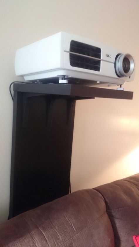 A video projector stand that won't screw up your wall Wall Shelf Behind Couch, Couch Decorating Ideas, Projector Screen Stand, Shelf Behind Couch, Projector Shelf, Projector Setup, Projector In Bedroom, Projector Stand, Best Projector