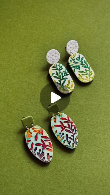 Polymer Week on Instagram: "White polymer clay, Texture Stamp, colorful Alcohol Inks… this technique is simple, but so much fun! 🌿  And what to do with the final slab? @dellinedesigns decided to sand off the baked surface and created lovely earrings where the pattern stands out beautifully." Stamping Polymer Clay, Polymer Clay Surface Techniques, Stamping On Polymer Clay, Polymer Clay Patterns, Polymer Clay Texture, White Polymer Clay, Clay Texture, Instagram White, Alcohol Inks