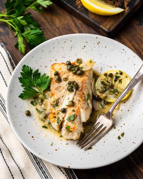 Cod piccata with salty capers, bright lemons, and sliced garlic in a buttery white wine sauce can be ready in about 30 minutes. This cod piccata is simple enough for weeknights but special enough for holidays and gatherings. #codpiccata #fishpiccata #lemoncod Cod Piccata Recipe, Cod Piccata, Sip And Feast, Feast Recipes, Italian Seafood, Cod Fish Recipes, Piccata Recipe, Seafood Entrees, Italian Favorites