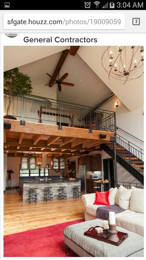 Loft over kitchen open to great room Stairs In Center Of Living Room, Modern Farmhouse Kitchens Rustic Industrial, Loft Above Dining Room, Loft Over Kitchen Ideas, Balcony Over Kitchen, Farm Loft House Design, Loft Over Kitchen High Ceilings, Barndominium Loft Railing, Four Bedroom Barndominium Plans With Loft