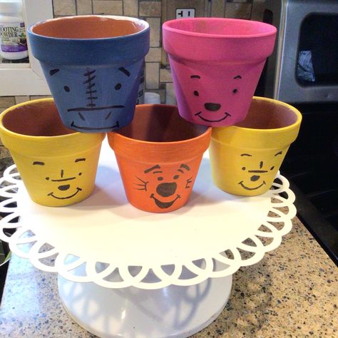 DISNEY FLOWER POTS. Pooh, Piglet, Eyeore and Tigger. Easy DIY, Acrylic Paints, Black Sharpie, and TERRA COTTA pots. Diy Winnie The Pooh, Winnie The Pooh Piglet, Terra Cotta Pots, Flower Pot Art, Shower Gift Ideas, Pooh And Friends, Terra Cotta Pot Crafts, Pooh Piglet, Pot Crafts