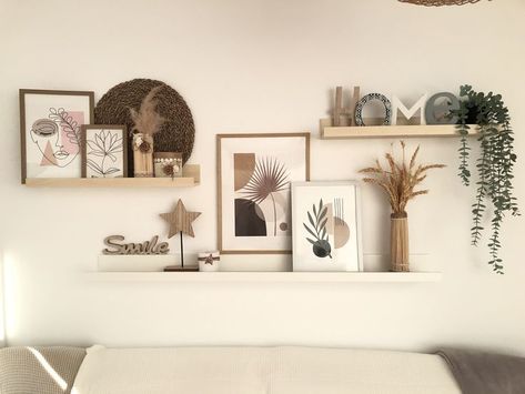 28 Best Wall Decor Ideas To Decorate Your Blank Wall - Foyr Welcome Home Wall Decor, Picture Shelf Aesthetic, Photo Shelves Bedroom, Floating Shelves With Frames, Three Shelves On Wall, Lounge Wall Shelf Ideas, Three Shelves Above Couch, Floating Wall Shelf Ideas Living Room, Decoration Wall Living Room