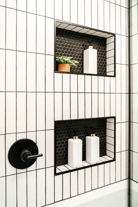 Honeycomb Bathroom Tile Showers, Bathroom Ideas Vertical Tile, Vertical Subway Tile Shower Wall, White Tile And Black Grout Bathroom, Black White Tiled Bathroom, Black Bathroom Niche, Shower Niche Black And White, White Subway Tile Shower Niche Ideas, Vertical Subway Tile Bathroom Black Grout