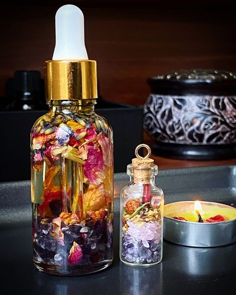 The herb infused oil contains...  -Almond Oil  -Grapefruit Essential Oil -Tangerine Essential Oil -Amethyst  -Rose Quartz  -Garnet -Orange Peel  -Rose Petals  -Lavender  -Rose Buds  -Hibiscus  -Motherwort  -Passion Flower This beauty oil was created to be used on hair, skin and nails. Please apply on small areas at first to test on skin, especially when applying the oil to the face. I highly recommend this product to be used on pulse points to get the full aromatherapy benefits {Wrists, Temples, Neck, Chest, Inner Elbow, and Behind the Ears} I also apply mine on the sides of my nose to relieve sinus pressure.  Disclaimer: Please be advised that I am not a medical professional. These products and statements have not been evaluated by the FDA. Please speak with a medical professional before Infused Oil, Flower Infused Oil, Relieve Sinus Pressure, Tangerine Essential Oil, Hair Care Recipes, Aromatherapy Benefits, Grapefruit Essential Oil, Beauty Oil, Herbal Oil