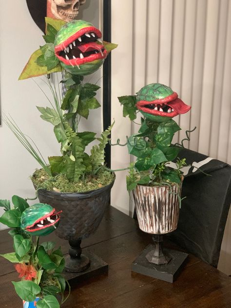 Made this using dollar Tree Items and stuff around the house. Foam footballs, fake nails, paint and Dollar Tree Foilage. Man Eating Plant Halloween, Little Shop Of Horrors Audrey, Man Eating Plant, Audrey 2, Horror Crafts, Nails Paint, Nightmare Before Christmas Tree, Man Eating, Halloween Outside